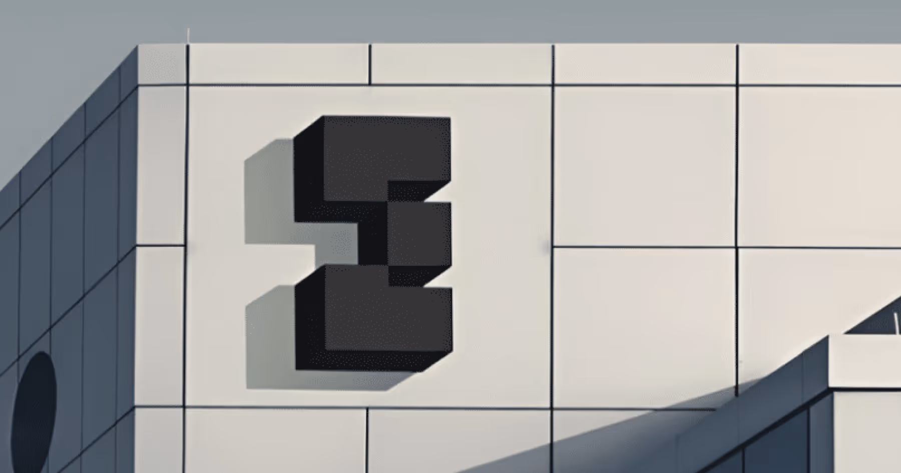 Close-up of an EdgeCore monogram logo on a data center building facade