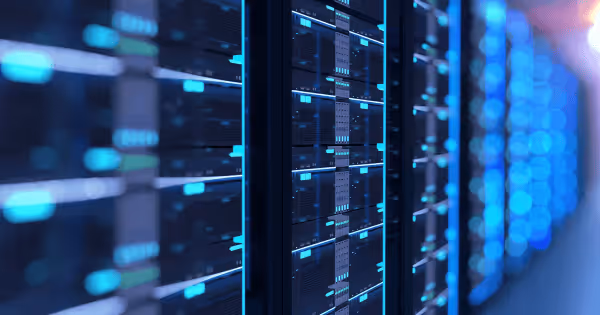 Illuminated blue server racks inside a data center