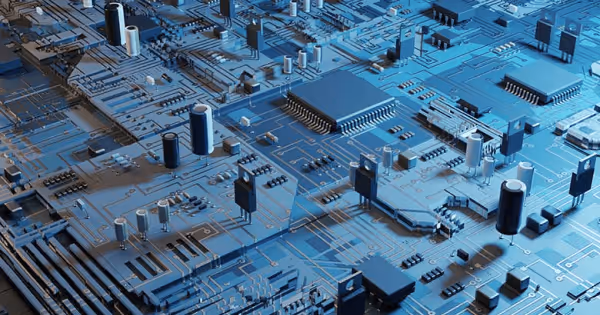 Aerial view of a circuit board with blue components and intricate pathways