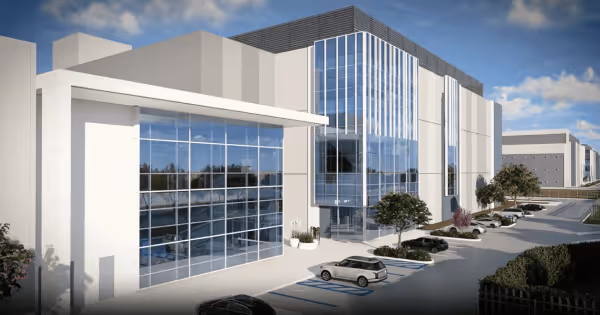 Architectural rendering of a modern data center building with large glass windows and adjacent parking