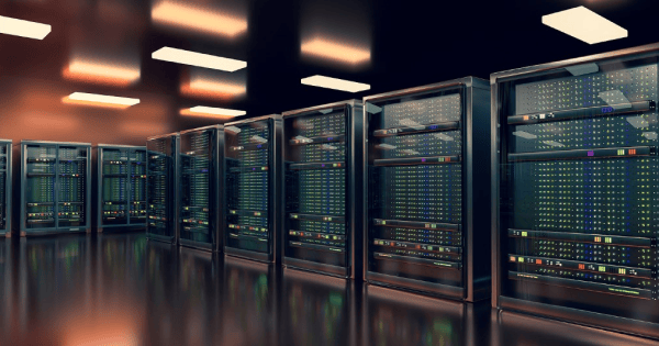 Row of illuminated server racks in a data center corridor