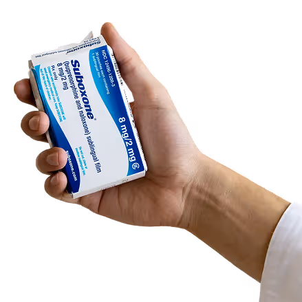 Hand holding a box of Suboxone 8 mg/2 mg sublingual film medication.