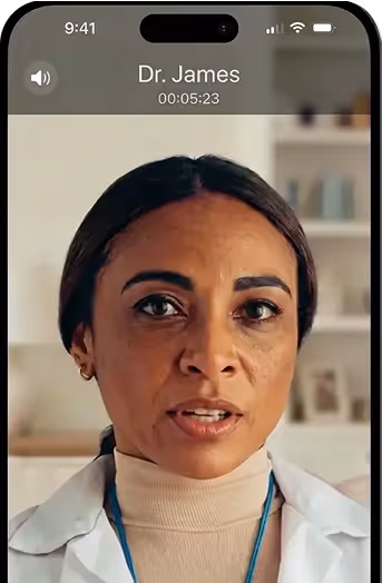 Video call on a smartphone showing a female doctor with dark hair and a white coat speaking, labeled Dr. James with call duration of 5 minutes and 23 seconds.