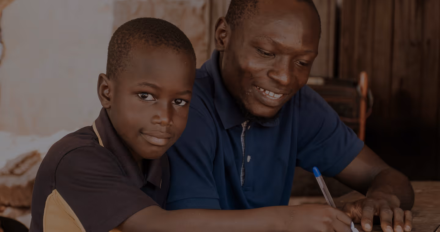 a man teaching a child