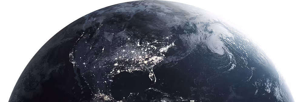 View of Earth from space showing North America at night with illuminated city lights.