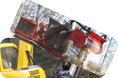 Yellow industrial wood chipper machine with red grinder attachment chipping wood outdoors near trees.