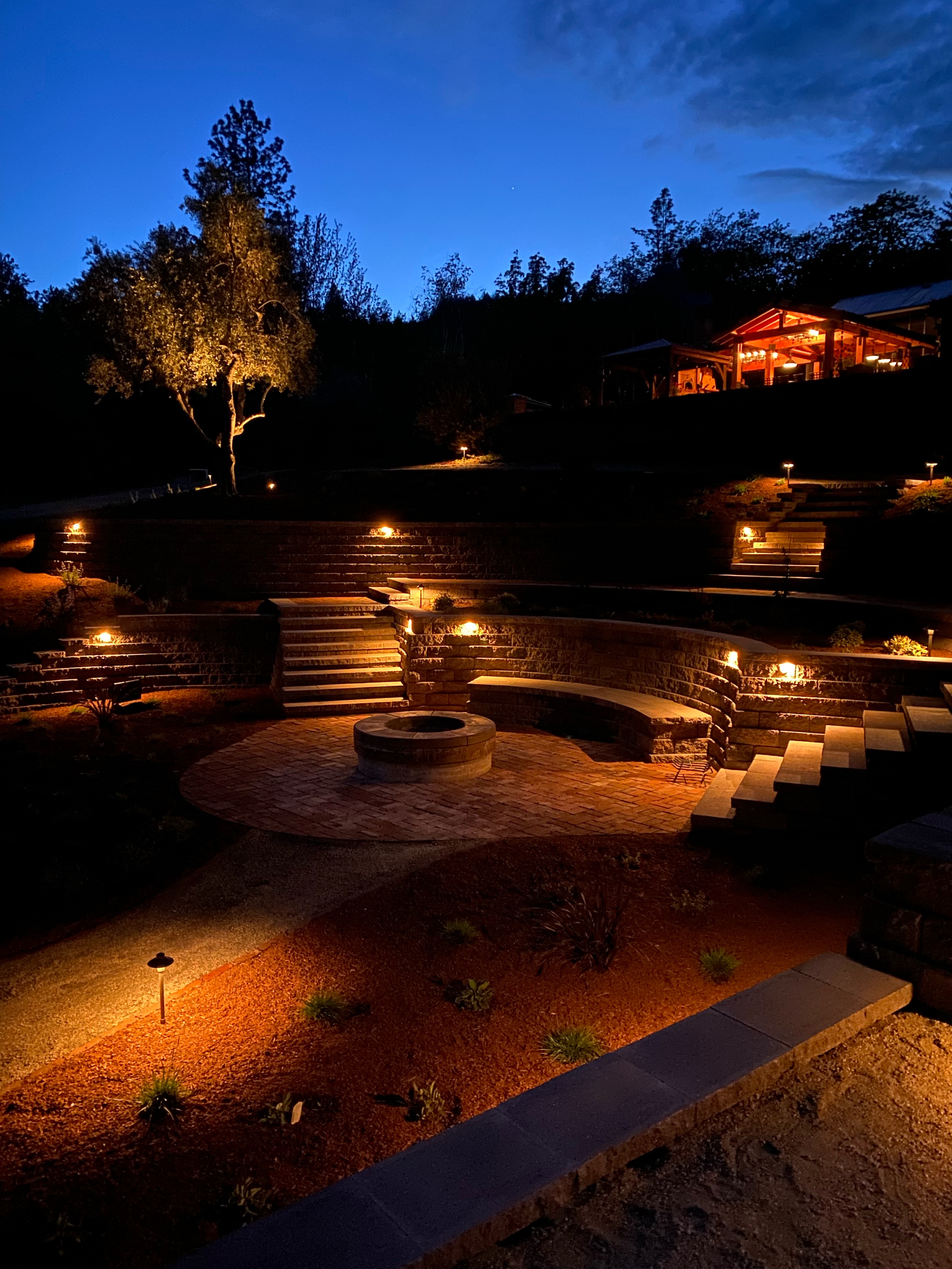Multi-level outdoor living space built with SRW block and landscape lighting