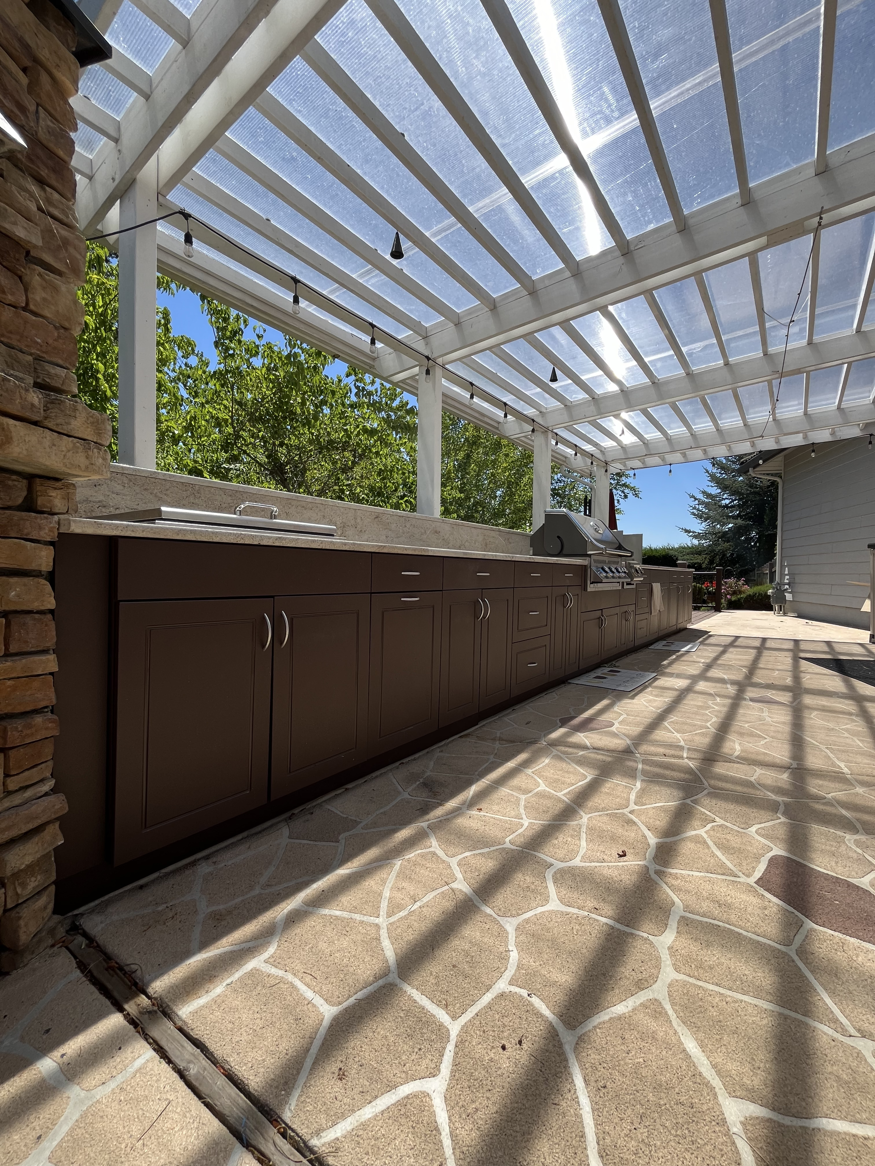 Curated landscaping framing an elevated patio space
