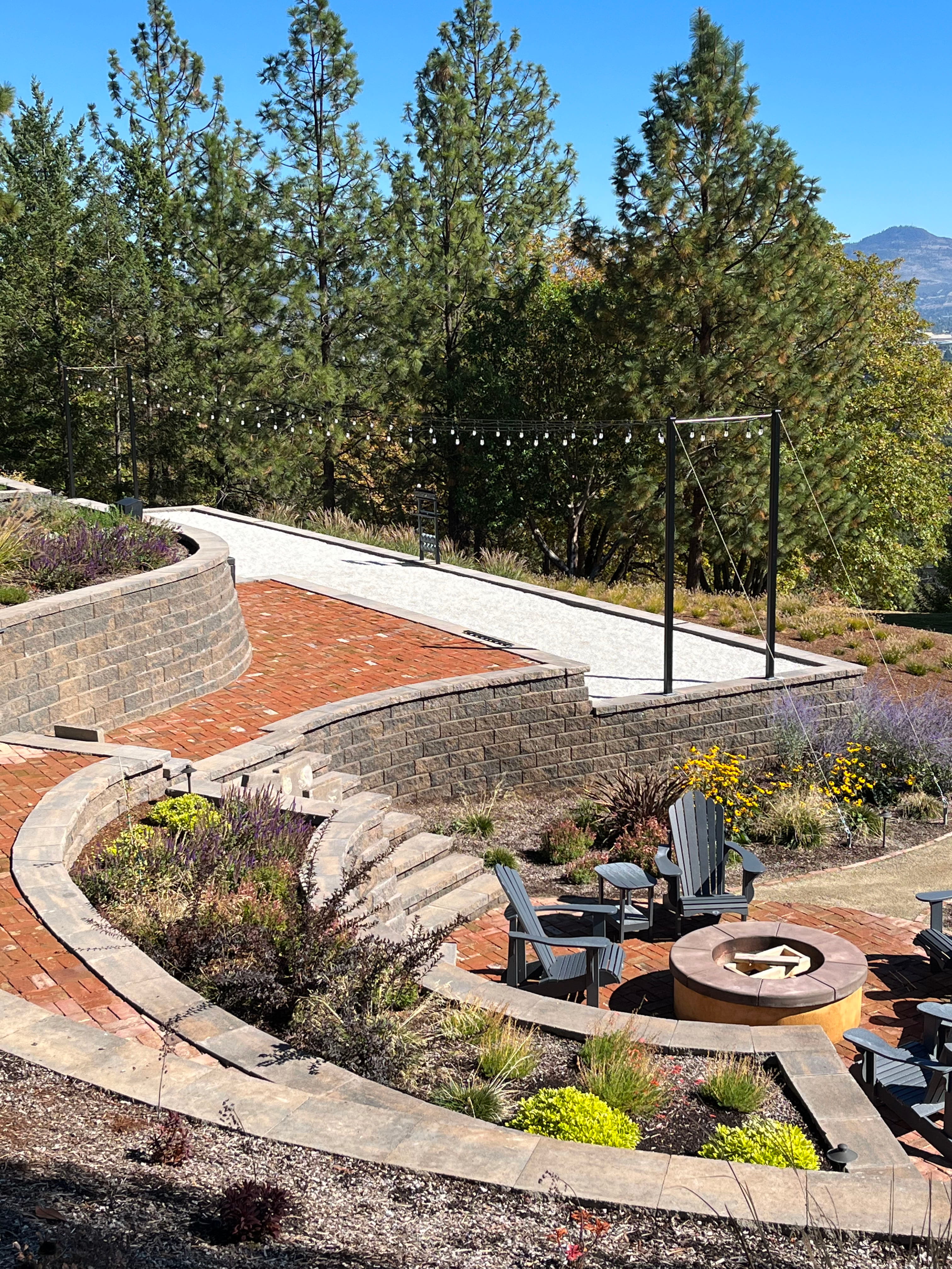 Shaded pergola lounge on a terraced Southern Oregon hillside
