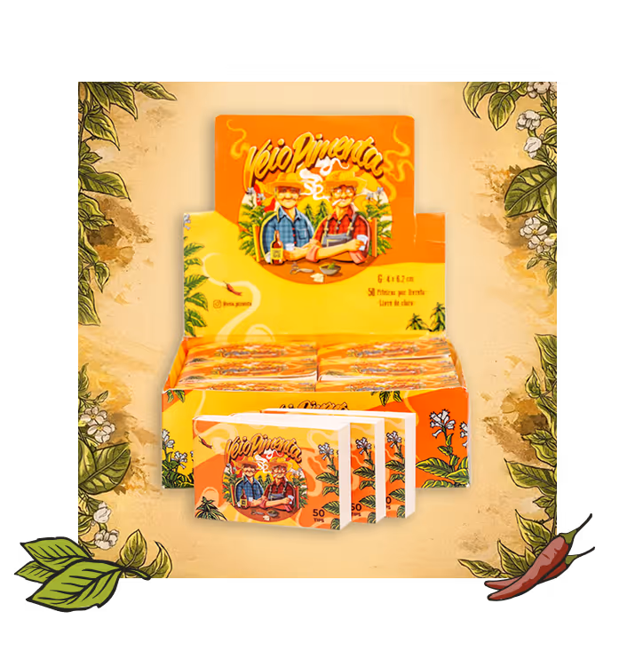 Display box of yellow-orange Veio Pimenta rolling paper packs featuring two men with hats and chili peppers illustration.