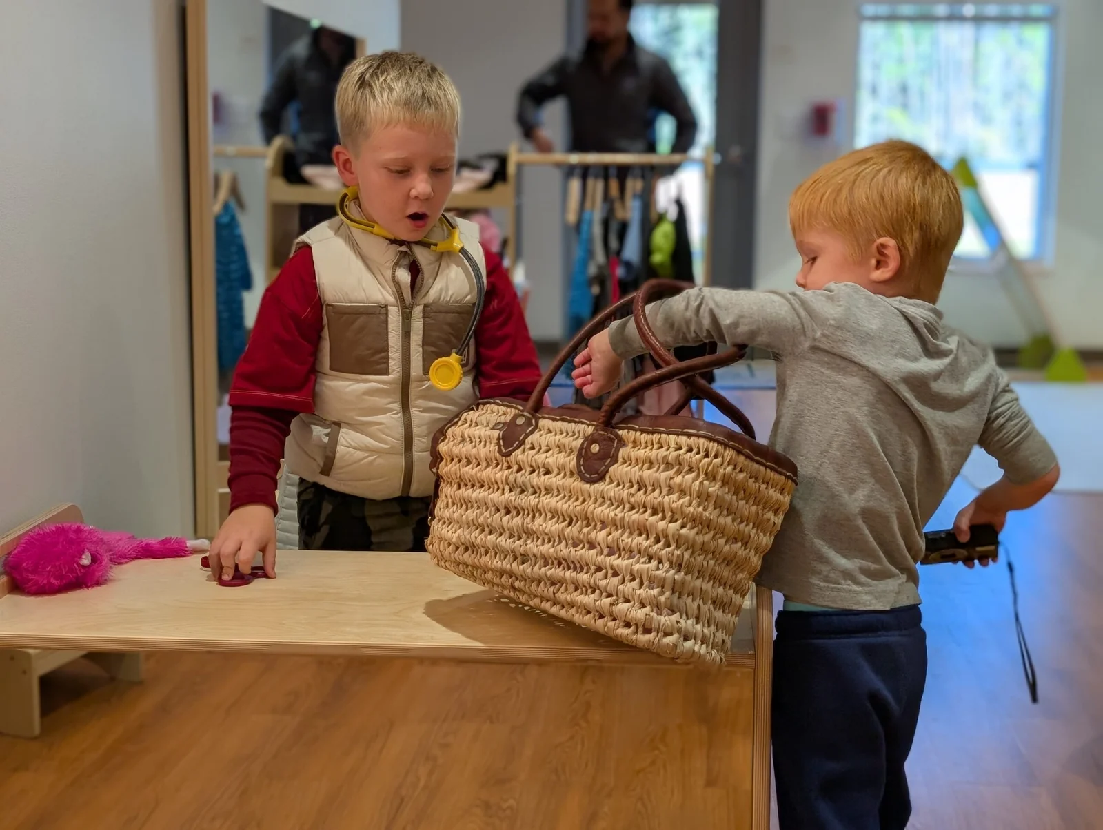 Two young boys playing indoors.