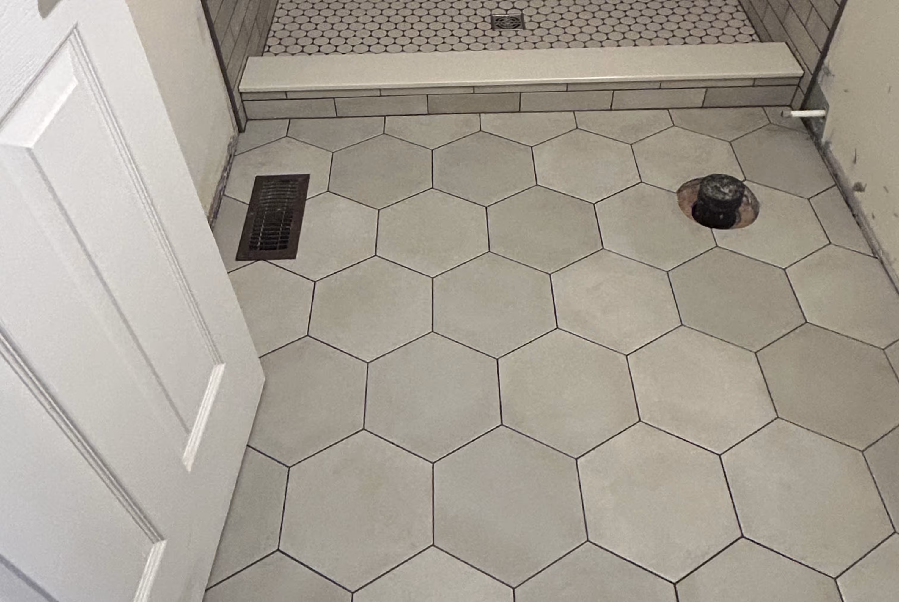 Custom built, durable, and timeless tile flooring.