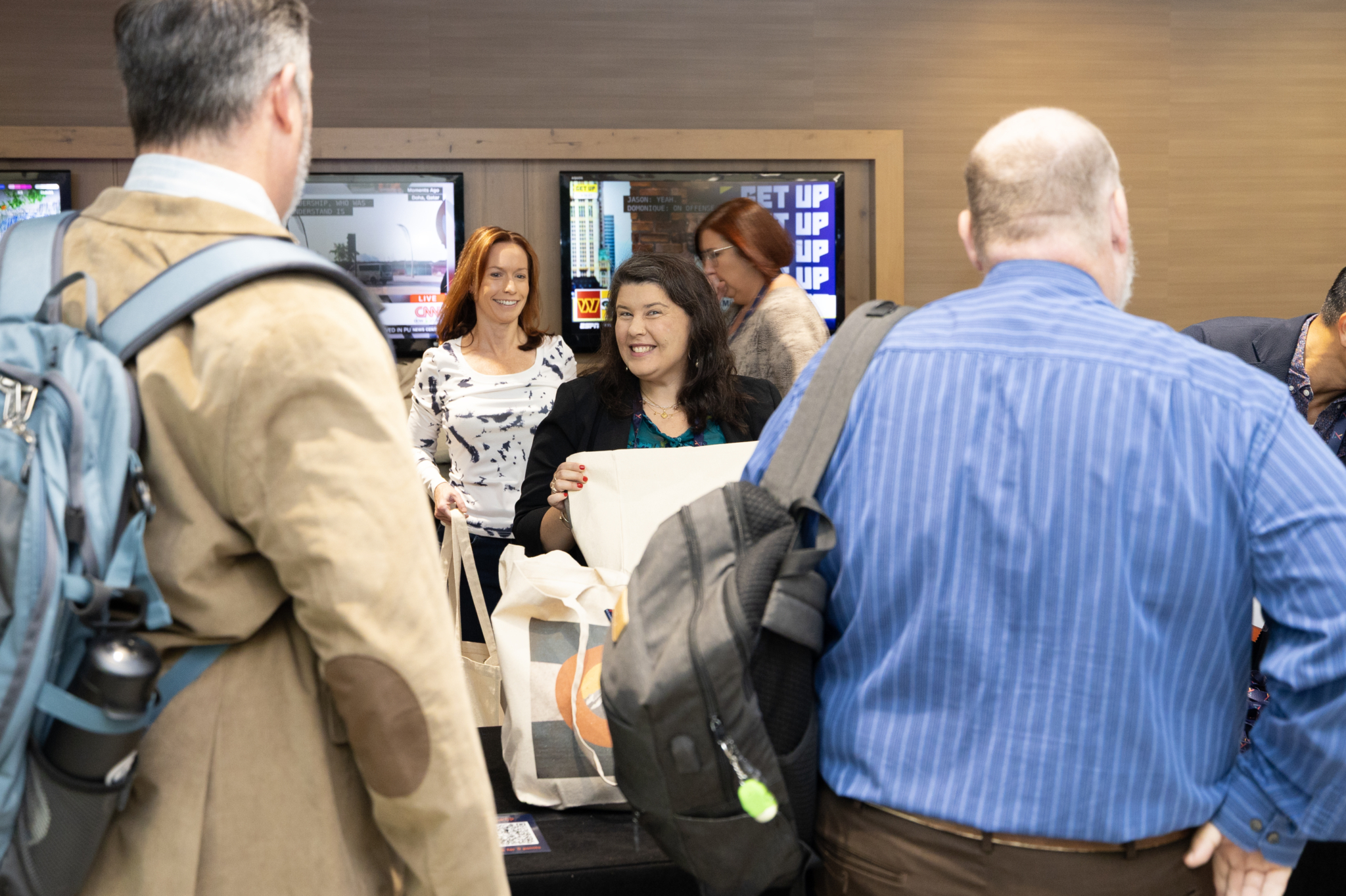 Exterro team greets customers at XChange