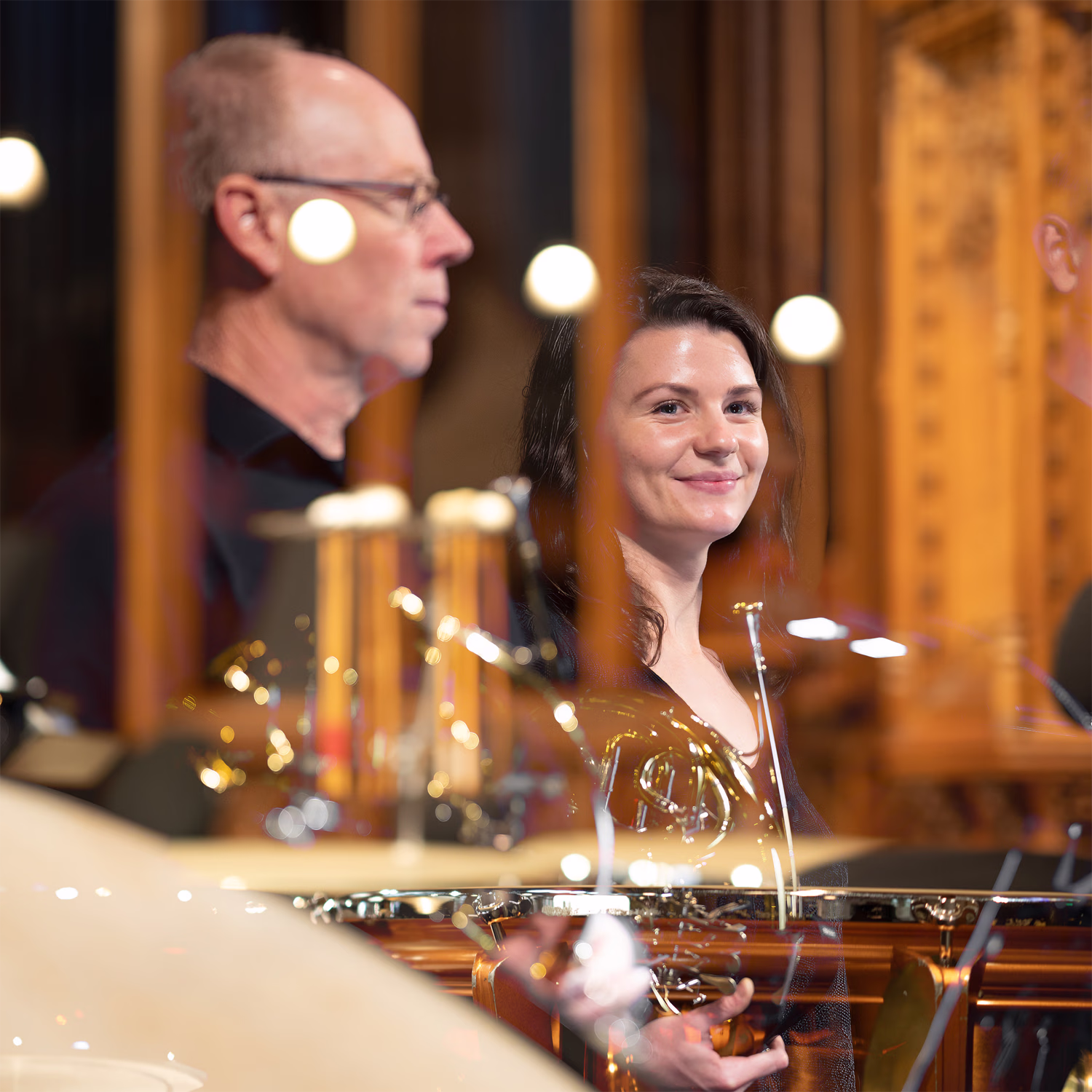Brass and percussion musicians.