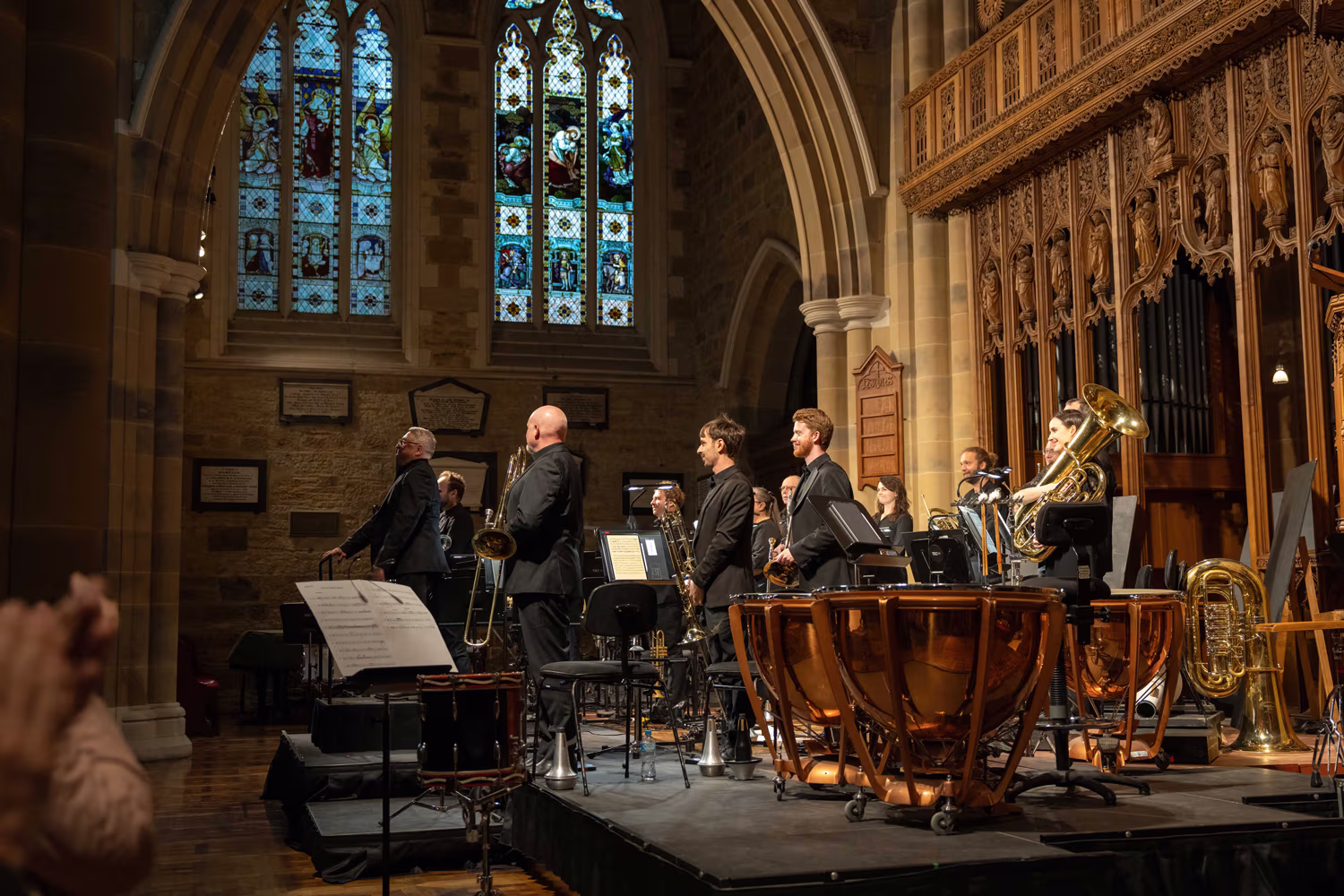 Brass and percussion musicians.