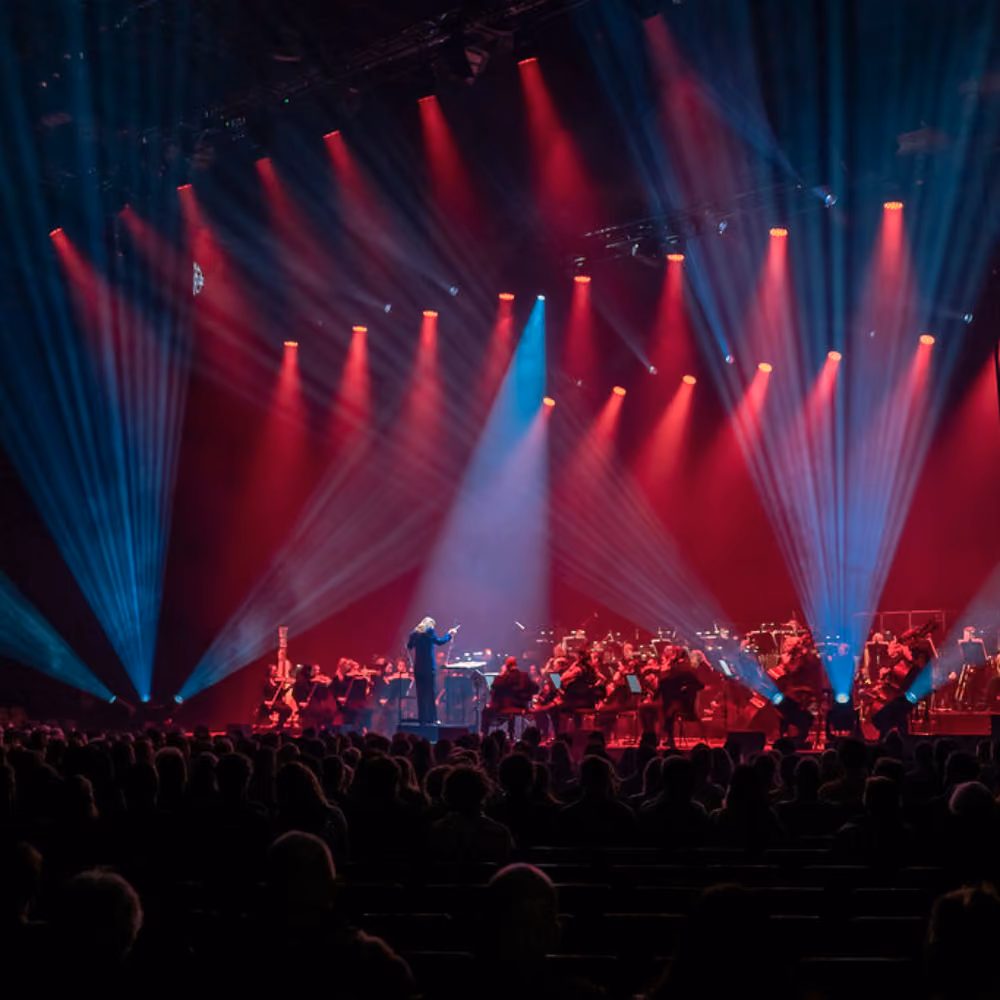 A major stage show with red and blue lights.