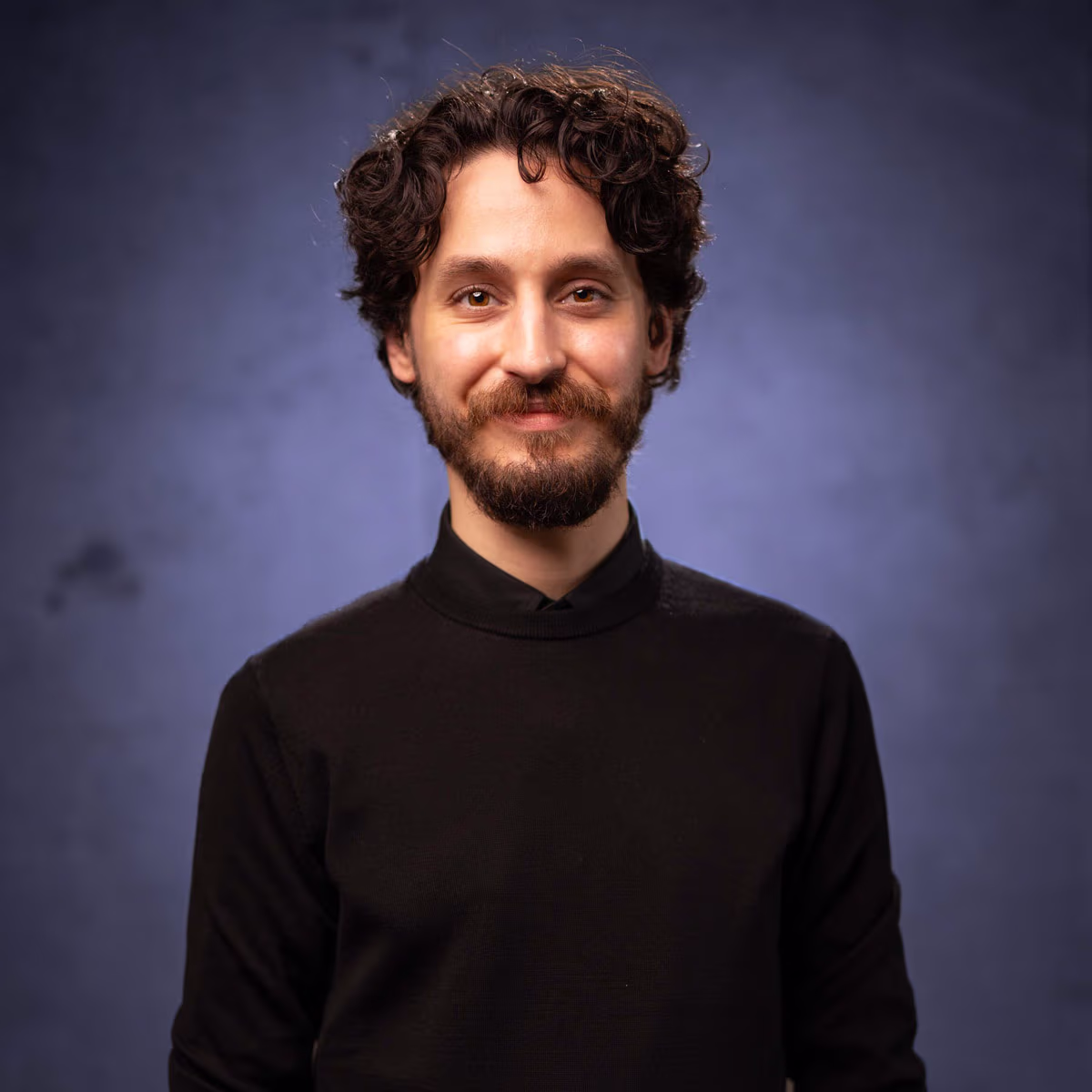 A man smiling at the camera.
