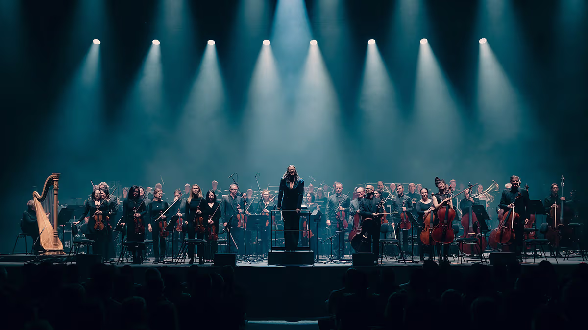 An orchestra stand under blue light.