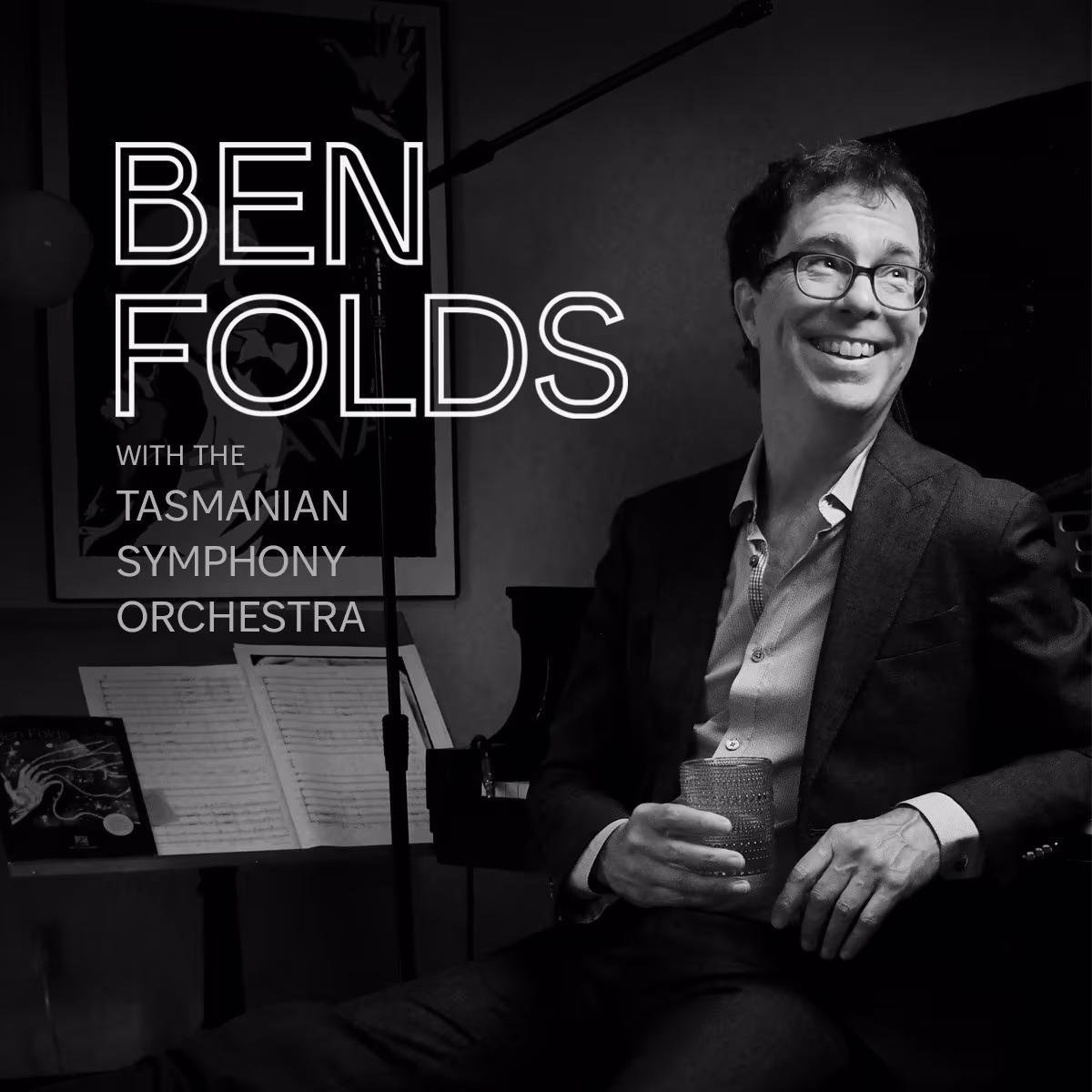 Ben Folds sitting at a piano.