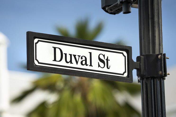 An image of Sloppy Joe’s Bar at night on the corner of Duval St. and Greene St.