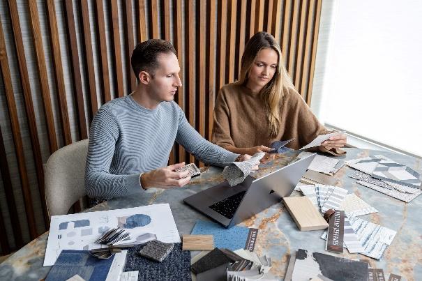 An image of Trevor Fulmer and Sophia Wensberg reviewing a design project.