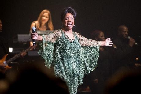 Gladys Knight singing with a microphone