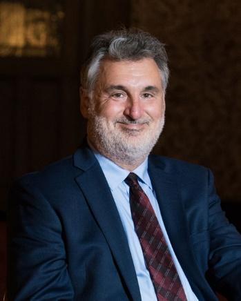 Florida Theatre President, Numa Saisselin in a suit and tie