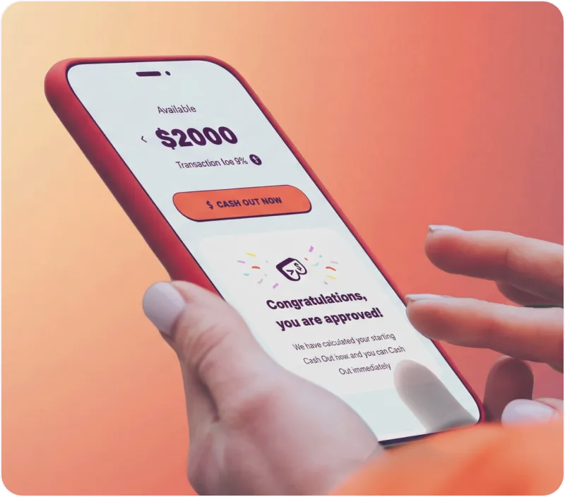 Hand holding a smartphone showing a $2000 available balance with an option to cash out and a message saying 'Congratulations, you are approved!' on an orange background.