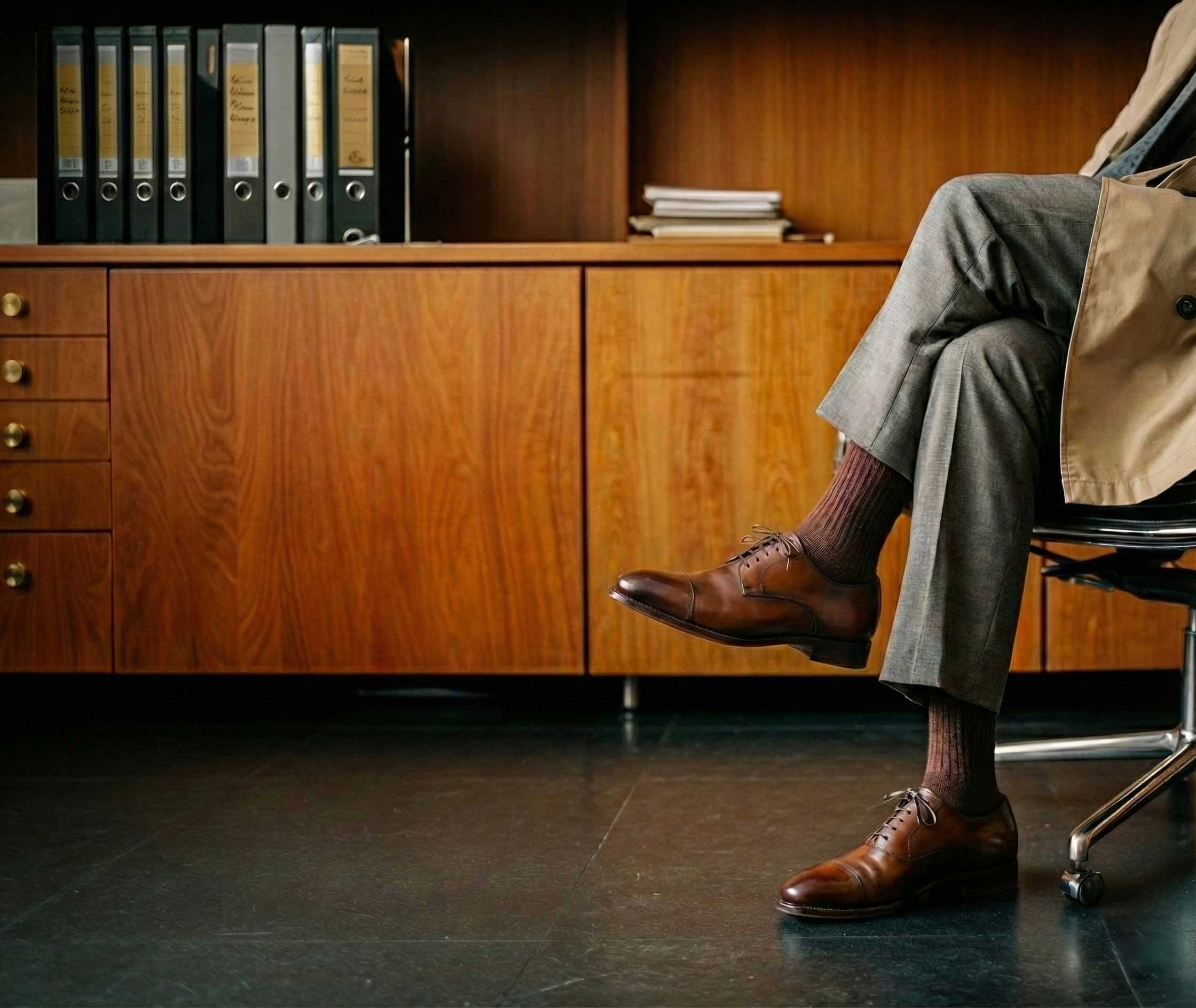 Executive sitting in chair, legs crossed
