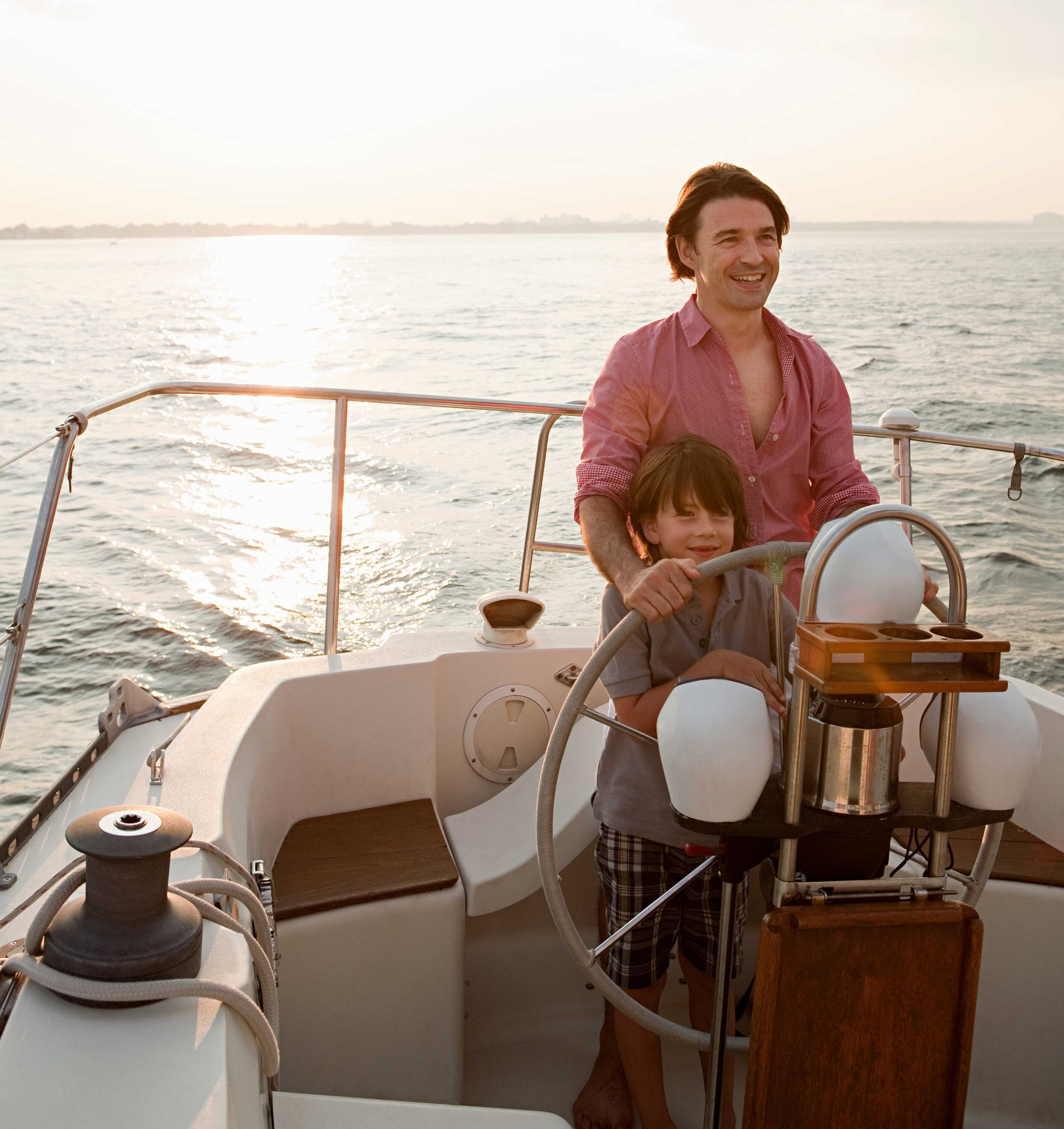 Sailing on vacation with father and son