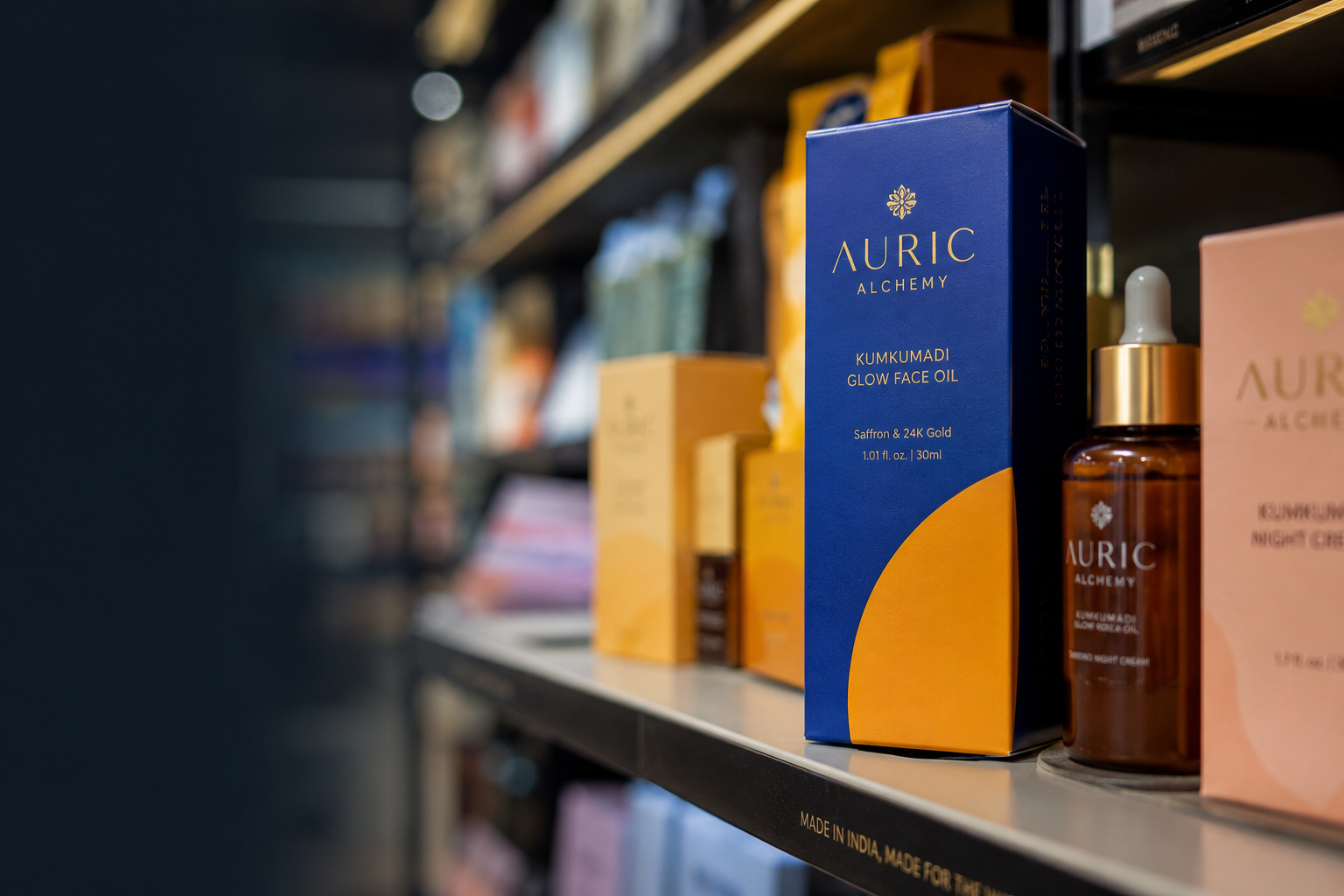 A close-up of cosmetics on a store shelf showcasing modern premium packaging design India trends. It features a bright royal blue and orange box for a face oil that stands out to influence consumer choices.
