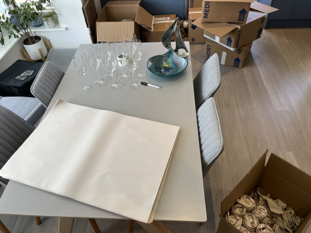 Professional packing service, boxes being carefully packed and wrapped