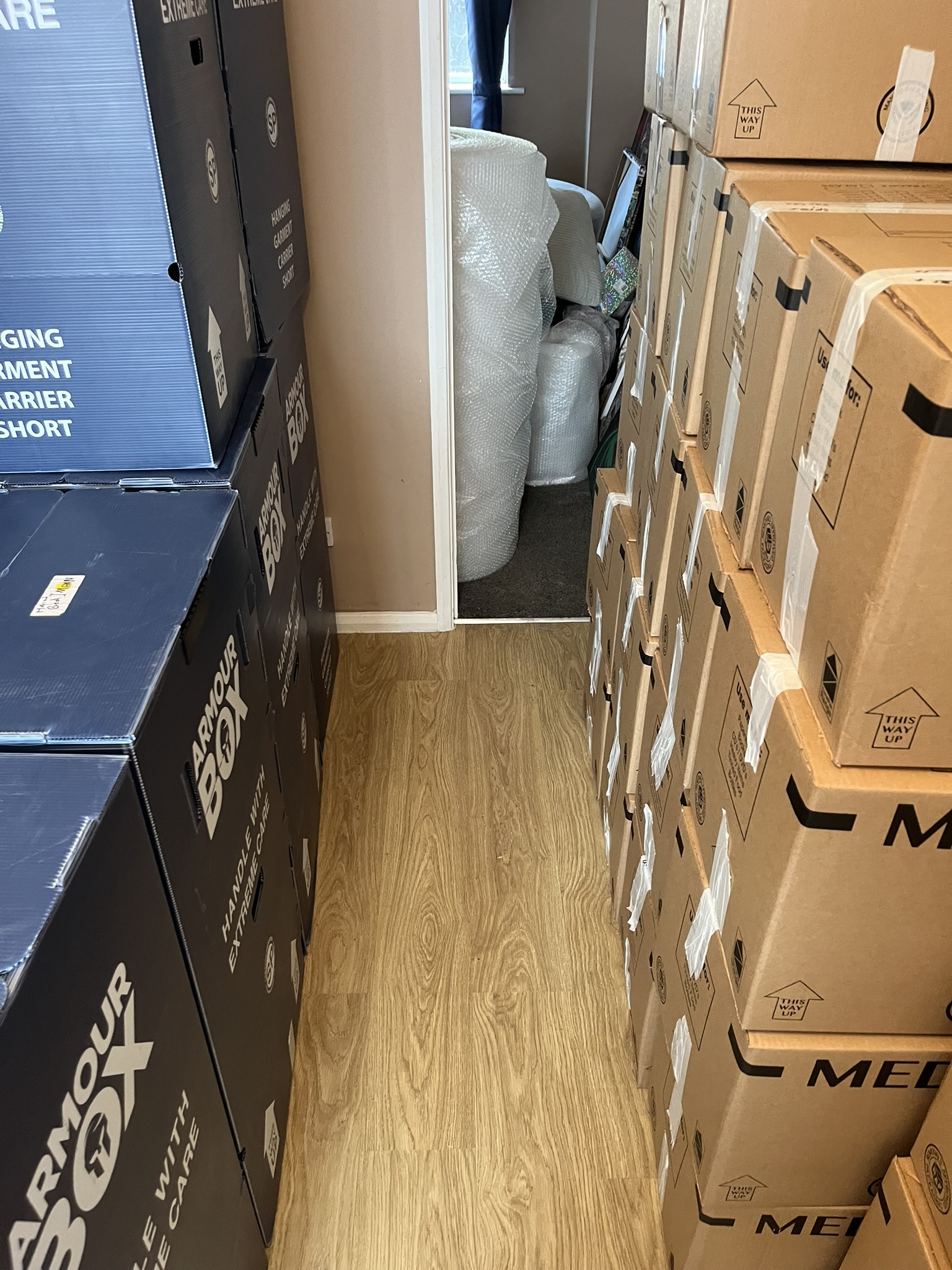 Moving crew navigating difficult staircase access in Bournemouth