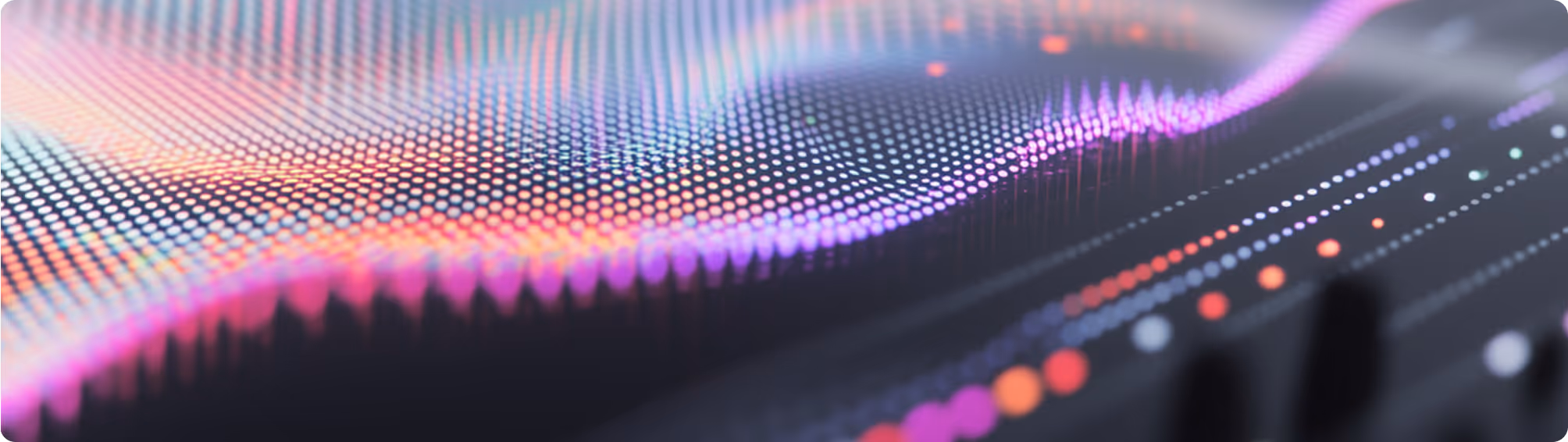 A colorful sound wave on a black background.
