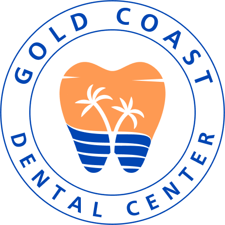 Logo of Gold Coast Dental Center featuring a tooth with palm trees and waves inside a blue circle.