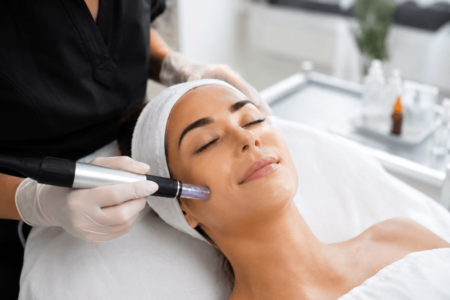 Client receiving microneedling facial treatment for smoother, brighter skin at a med spa in Bethesda, Maryland