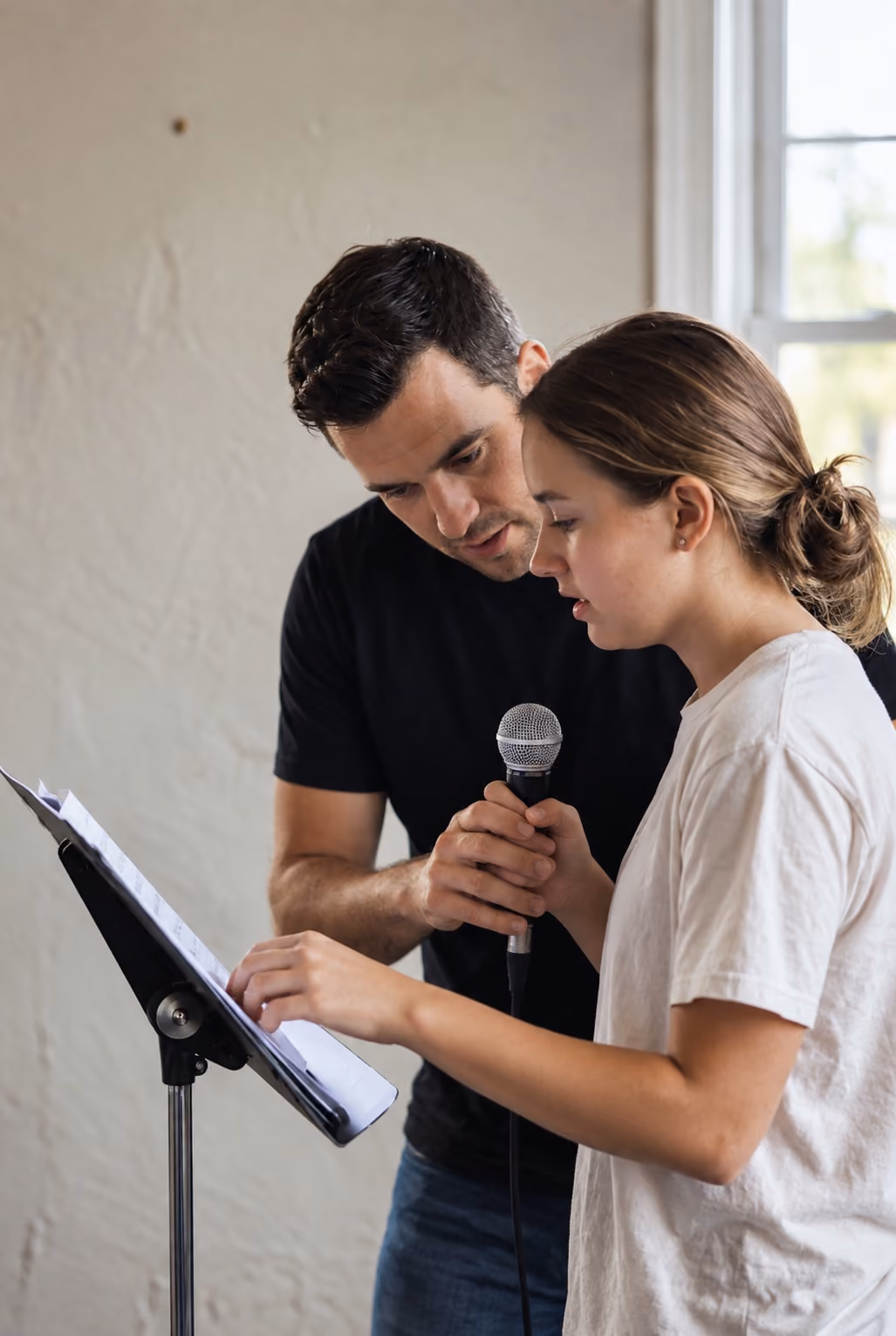 Man giving Vocal Coaching to a Likewise Students