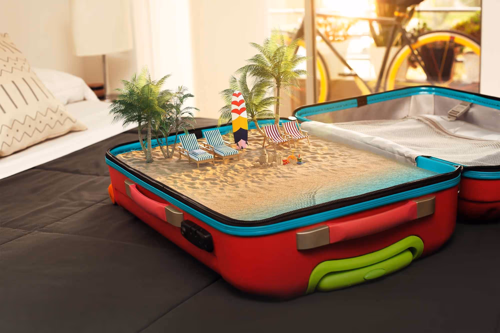A composite image showing sand and a parasol inside a suitcase