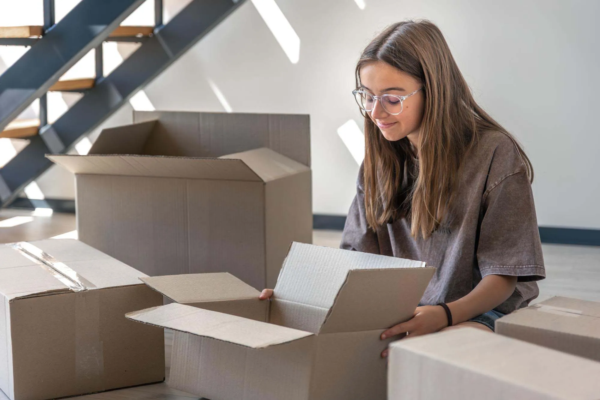 A woman with a storage box during a house move