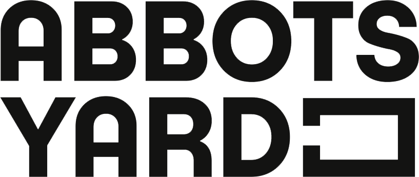Black text logo reading 'ABBOTS YARD' with a stylized letter E in YARD.