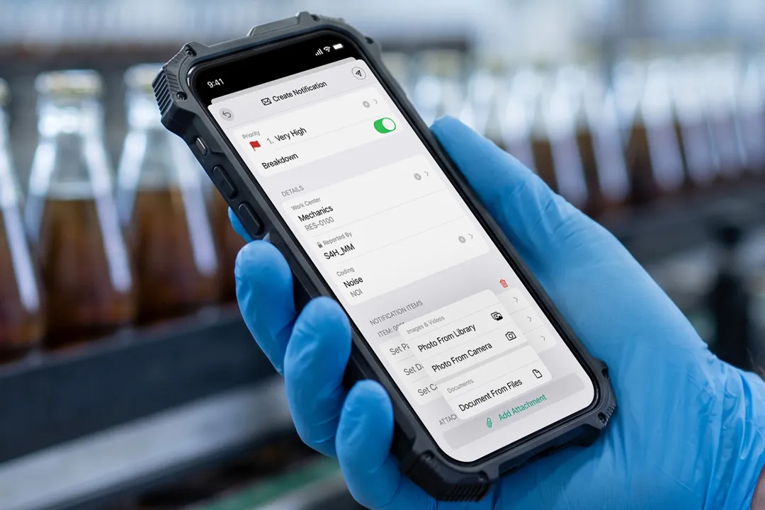 A close-up of an Operator looking at Arkyn FastNotifications on a phone at a beverage factory