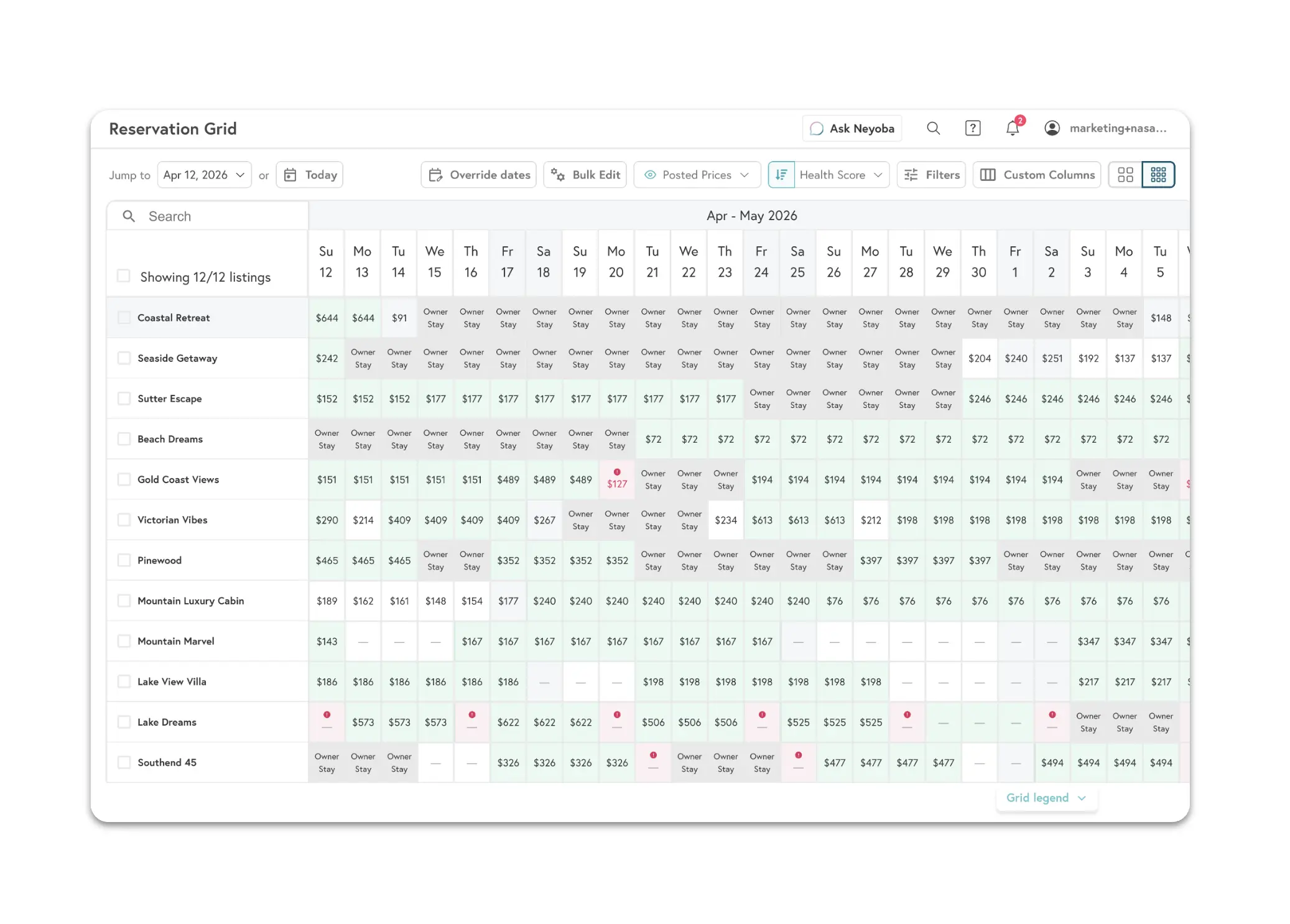 Beyond dynamic pricing dashboard showing reservation grid with nightly rates and availability across 12 short-term rental listings for April-May 2026