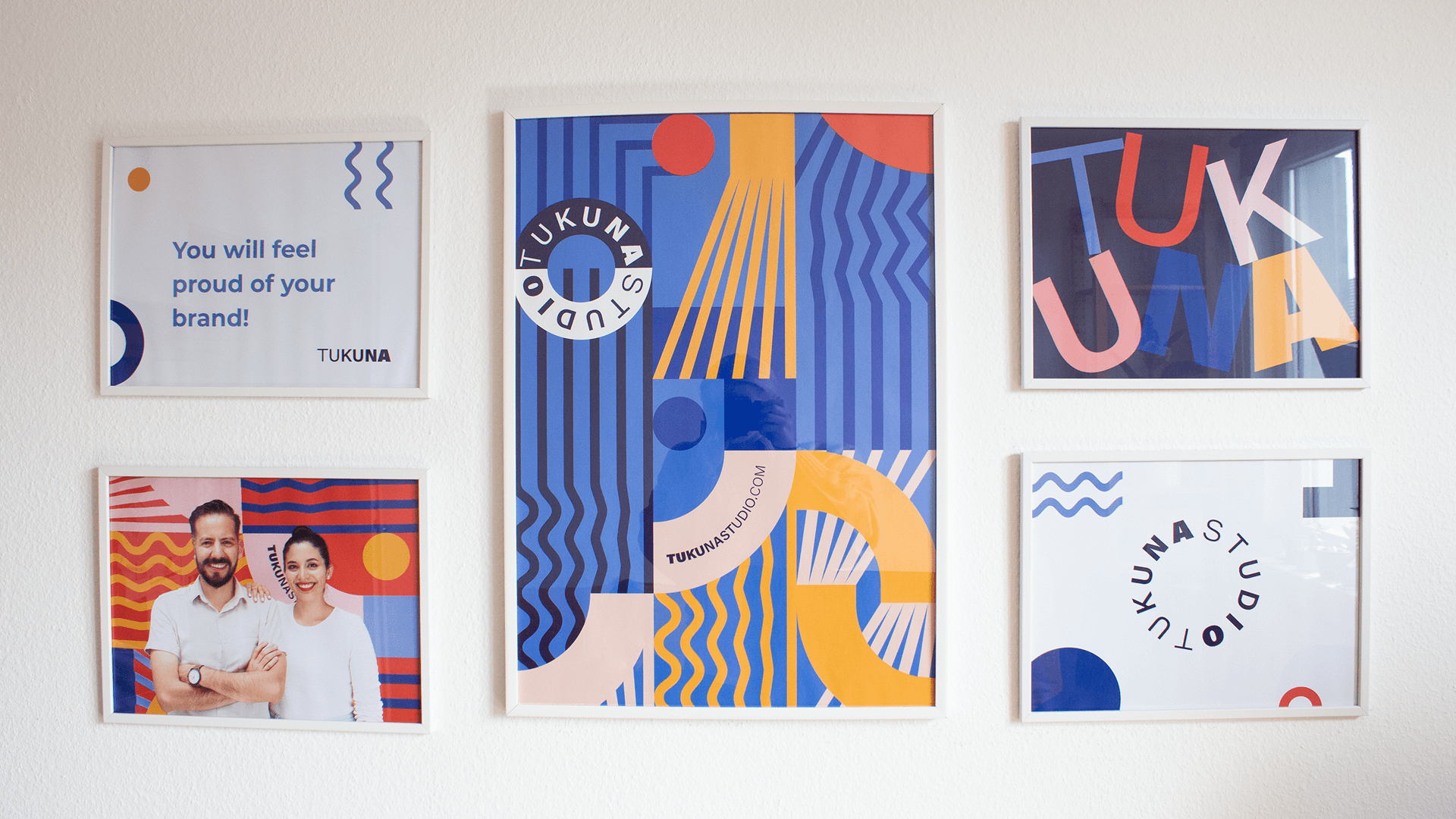 Gallery wall of five colorful framed Tukuna Studio prints