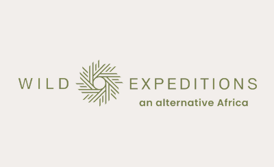 Wild Expeditions logo with geometric leaf design and tagline 'an alternative Africa'.