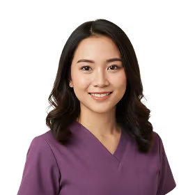 Smiling woman with dark hair wearing a purple scrub top against a transparent background.