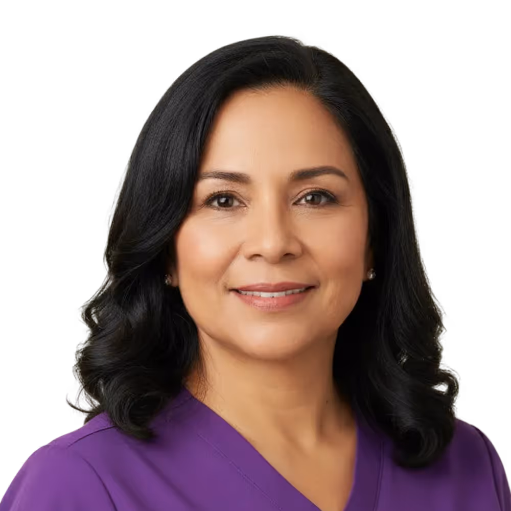 Smiling woman with medium-length black hair wearing a purple medical scrub top.