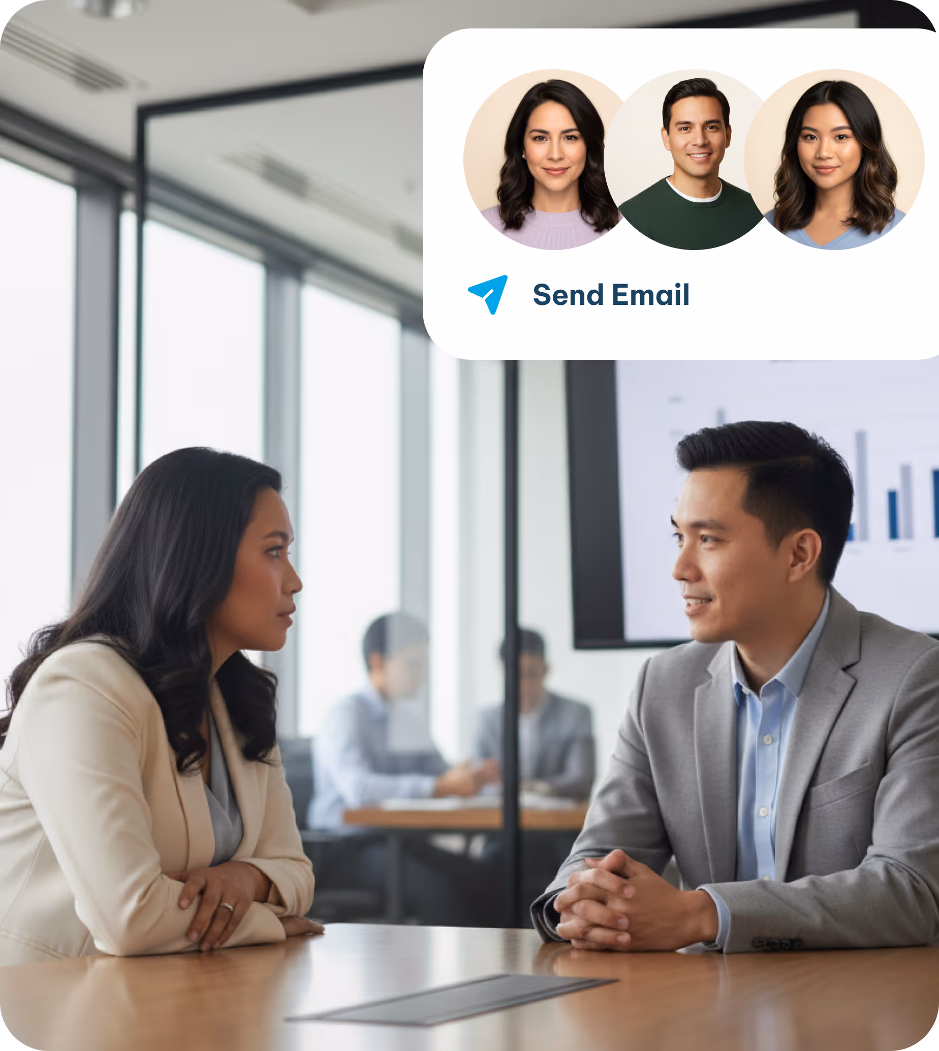 Man and woman in business attire engaged in a conversation across a conference table in a modern office.