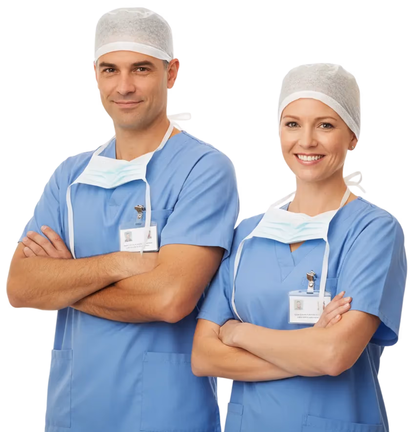 Male and female surgeons in blue scrubs and surgical caps with face masks hanging around their necks, standing with arms crossed and smiling.