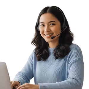Smiling woman with headset working at a computer, representing virtual medical receptionist.