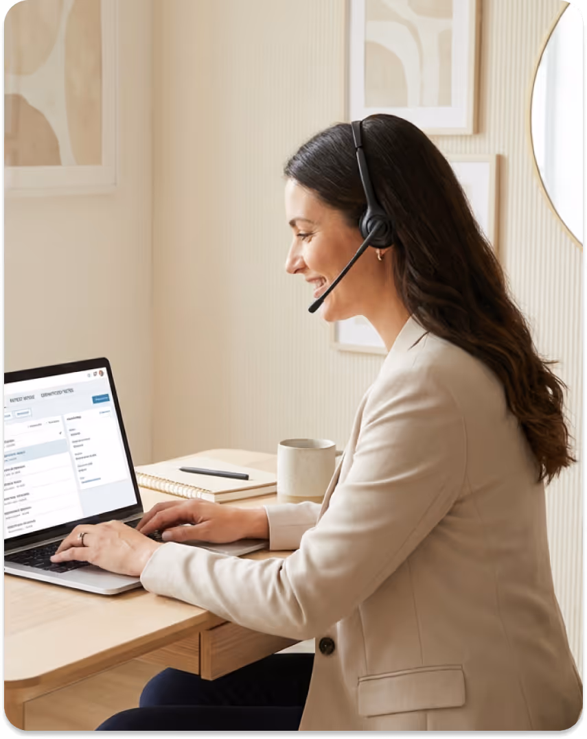 Smiling woman wearing headset and teal shirt with crossed arms next to HIPAA compliant emblem.